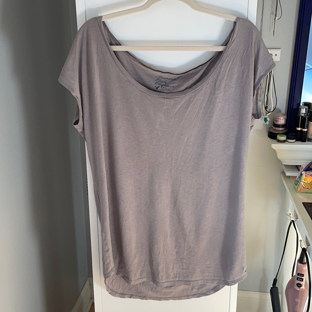 tan, short sleeved t shirt from American eagle. Very big for a size medium